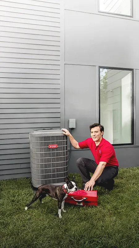 HVAC Technician beside outside AC unit with dog and toolbox | Bennett Heating and Air LLC