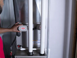 AC repair technician monitoring pipes | Bennett Heating & Air