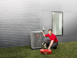 HVAC technician next to an outdoor HVAC system next to homeowners dog | Bennett Heating & Air