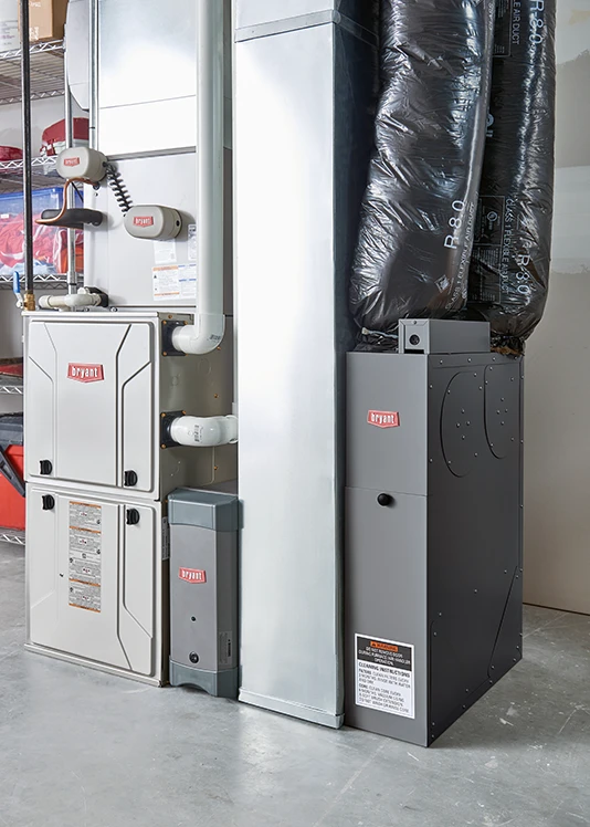A gas furnace system in a home's basement | Bennett Heating and Air LLC