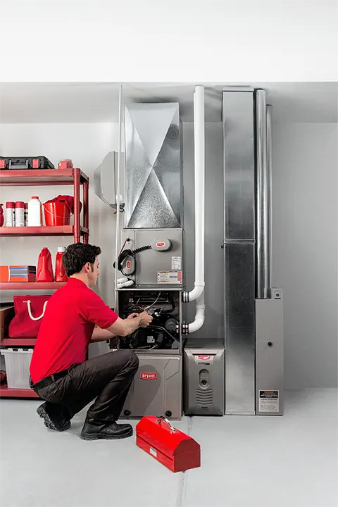 Bryant dealer repairing a homeowner's furnace | Heating Repair | Bennett Heating and Air LLC