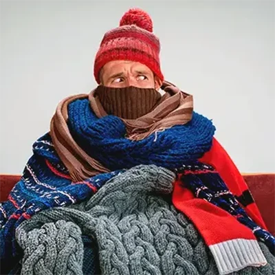 a person wearing a hat and scarf