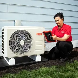Female technician maintenance installing a ductless mini-split ac - Mini-Split Installation - Bennett Heating and Air LLC